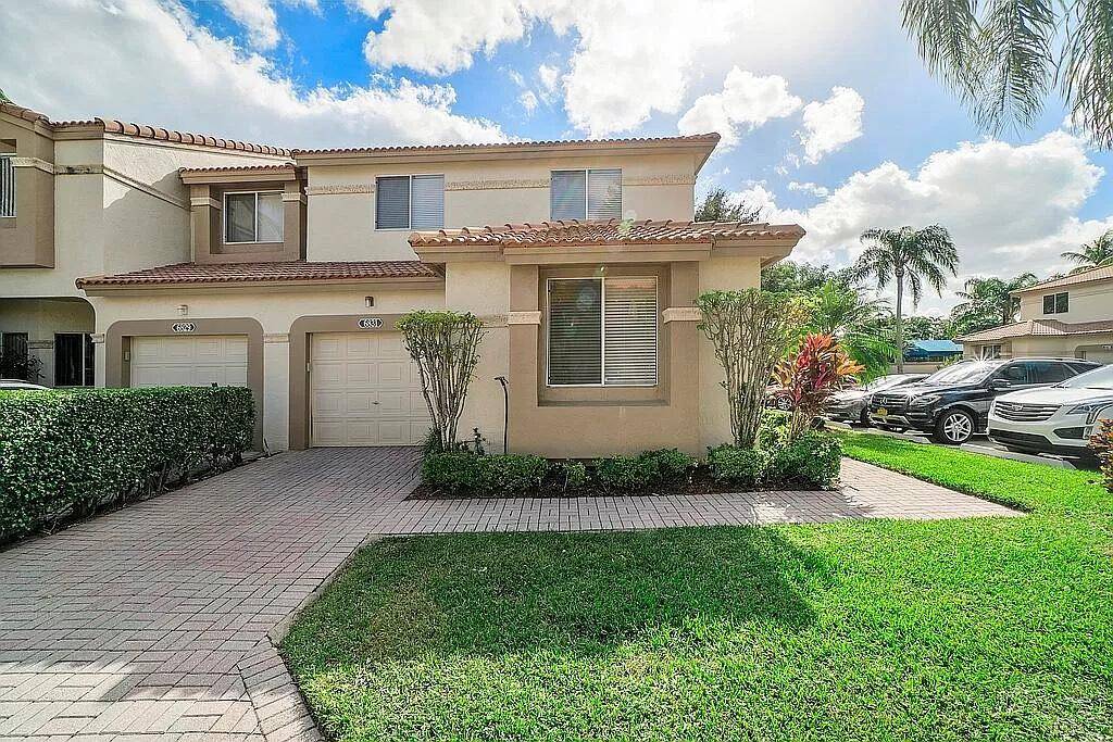 Rarely available spacious END unit town home in the manned gated community of Boca Pointe !