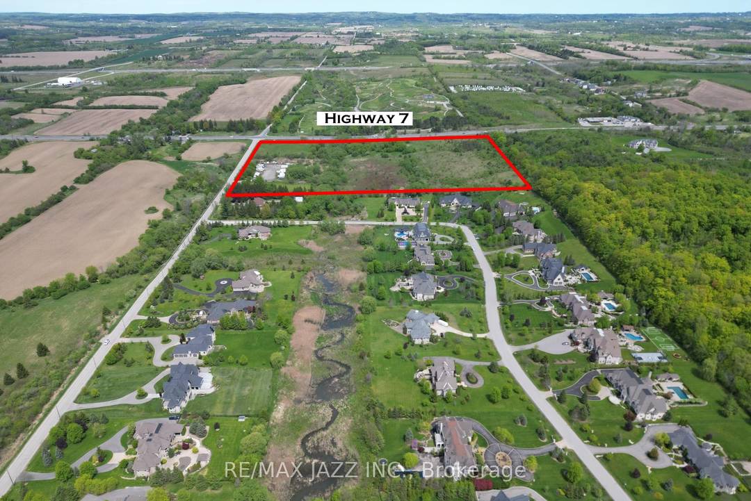 Imagine the future possibilities of this 32 acre piece of vacant land, with 1, 372 feet of frontage along HWY 7, and 1, 010 feet of frontage on Sideline Road ...