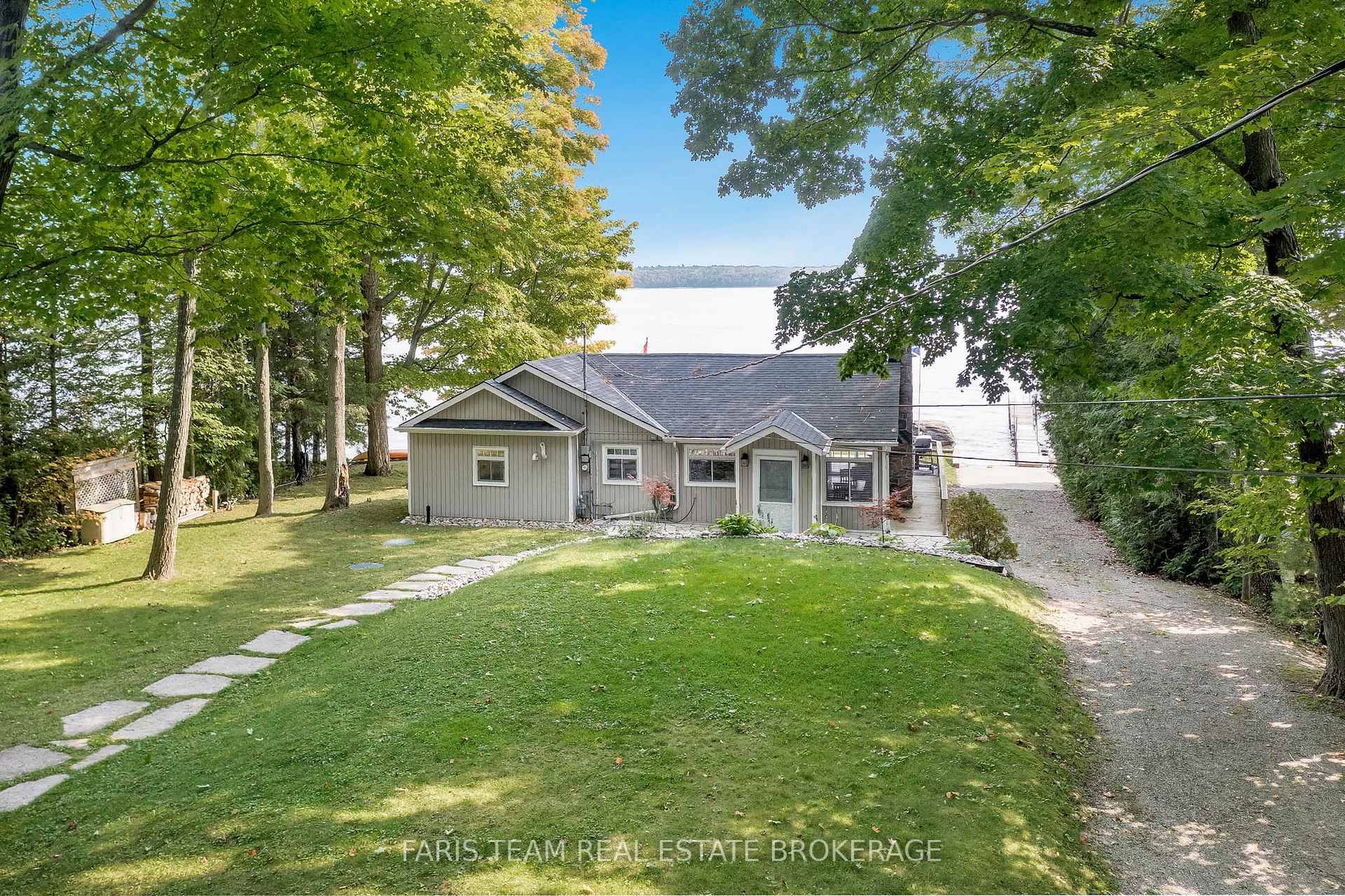 Top 5 Reasons You Will Love This Home 1 Unique waterfront property offering a haven of serenity, combining peaceful ambiance with enjoyable features, including its own private beachfront with 102' ...