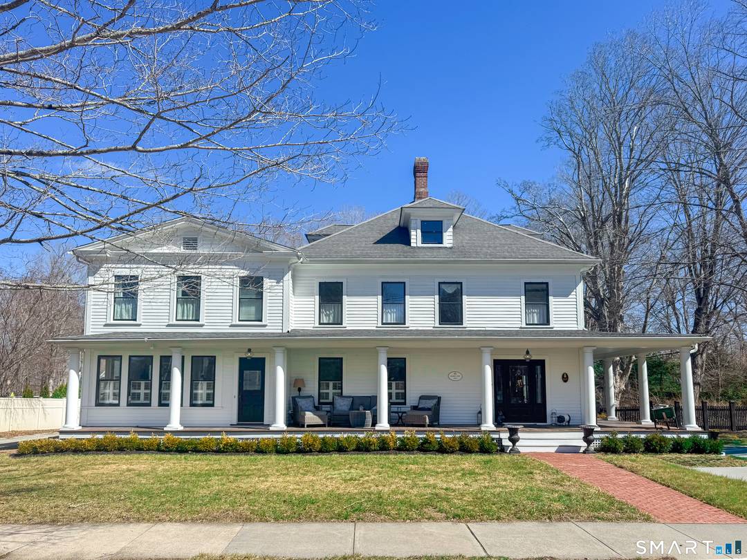 Nestled in the heart of Essex Village along one of its most picturesque streets, this iconic c.