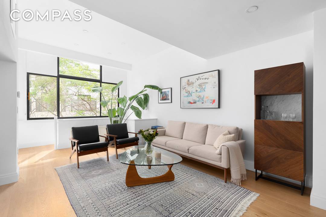 Introducing a rare opportunity to own a remarkable two bedroom, two bathroom duplex home with a home office den and two living spaces at 77 Bleecker Street, Unit 123E.