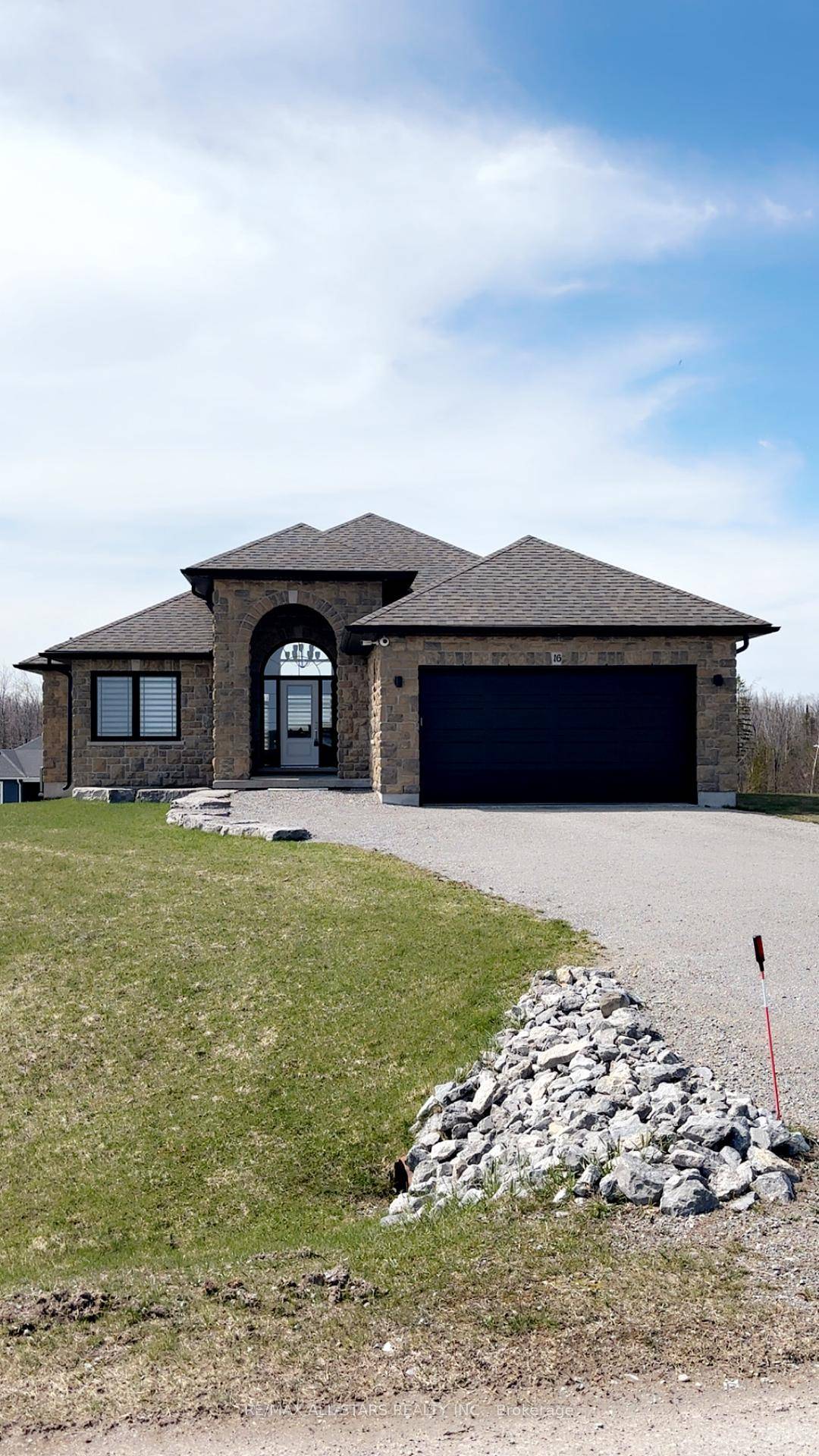 This elegant stone and brick 3 bedroom bungalow offers breathtaking area views of Sturgeon Lake.