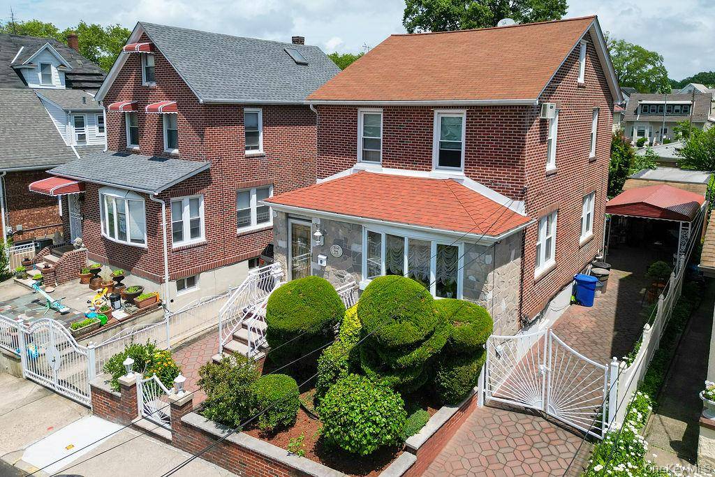 Beautiful solid brick 4 Bedroom Colonial in prestigious Flushing North neighborhood.