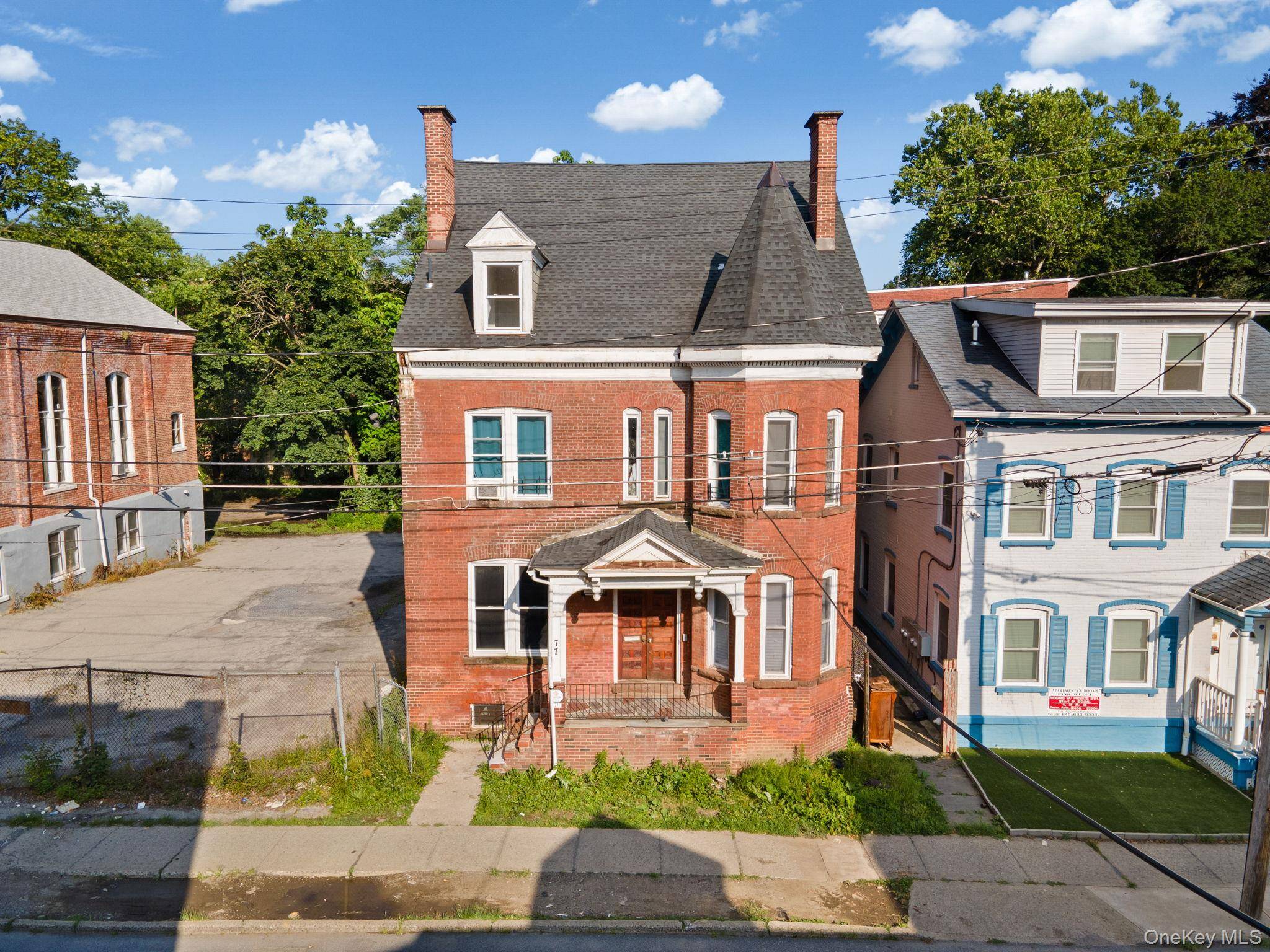 Welcome to 77 Academy Street, a stately brick three unit building located in Poughkeepsie s historic Academy Street District.