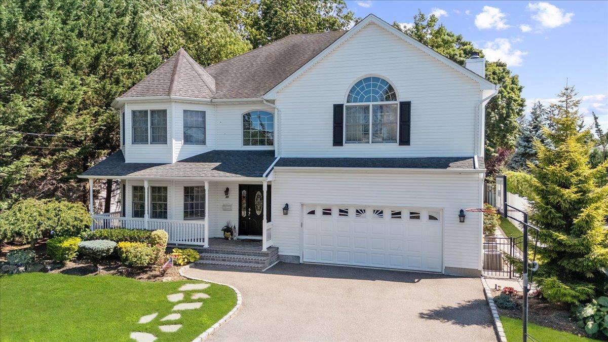 Welcome to this magnificent 4, 000 sq ft Colonial, built in 2005, nestled on an oversized 11, 800 sq ft lot in the heart of Bethpage.