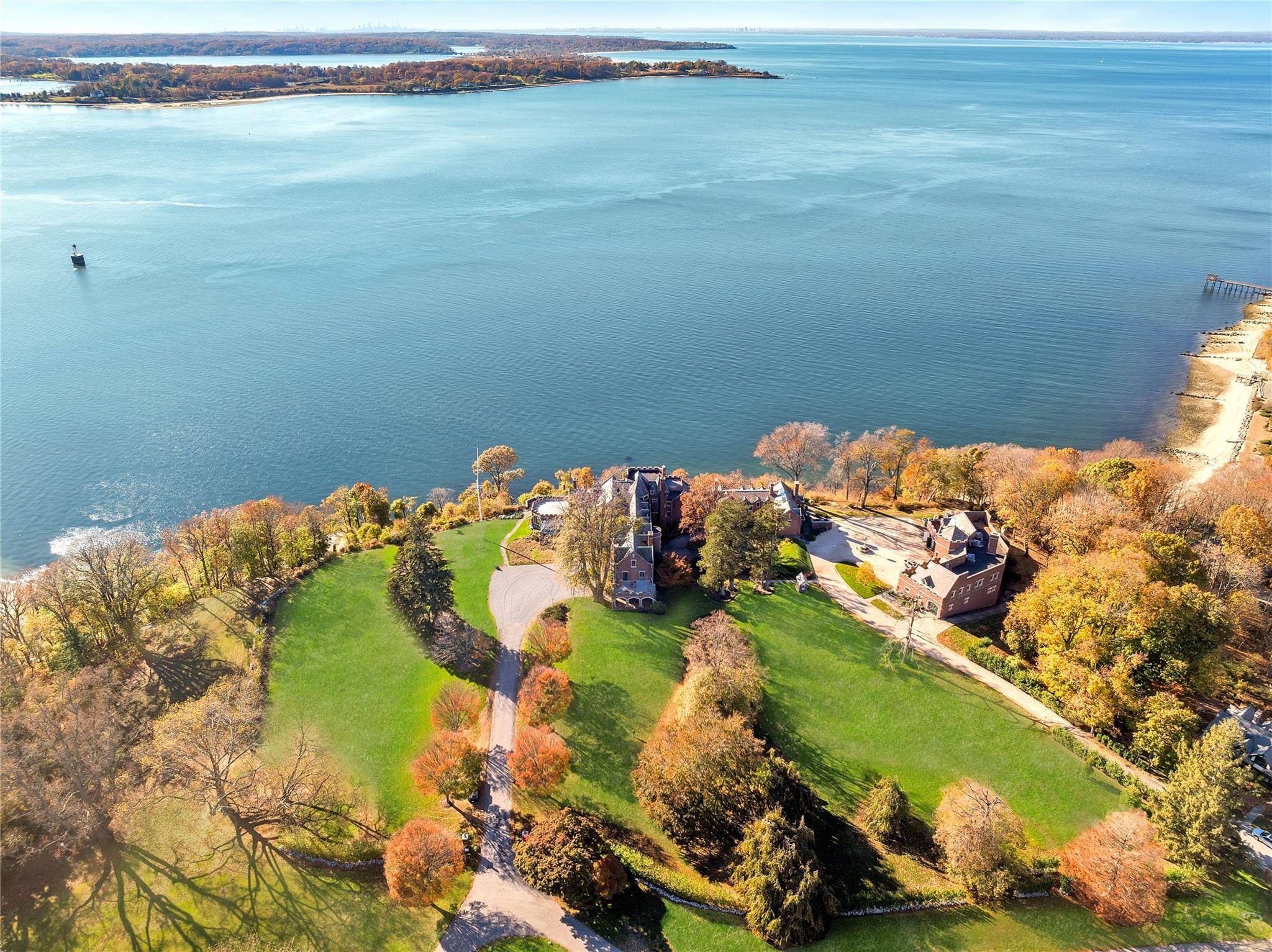 Welcome to 31 Fort Hill Drive, a landmark estate perched atop 10 private acres in the prestigious enclave of Lloyd Harbor.