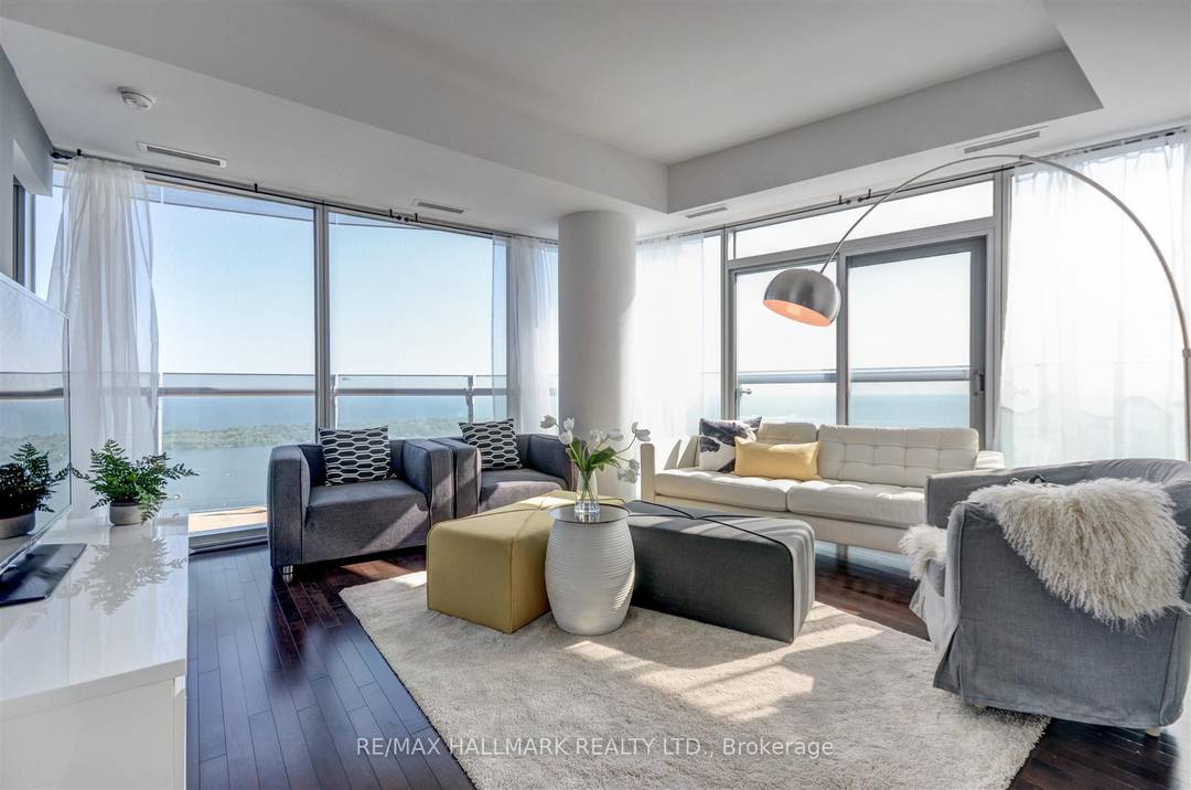 This stunning corner unit on the 54th floor offers rare unobstructed views of Lake Ontario and city vistas.