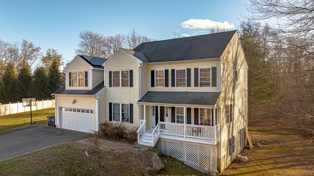 Welcome home to this spacious Colonial set at the end of a quiet cul de sac on over five private acres.