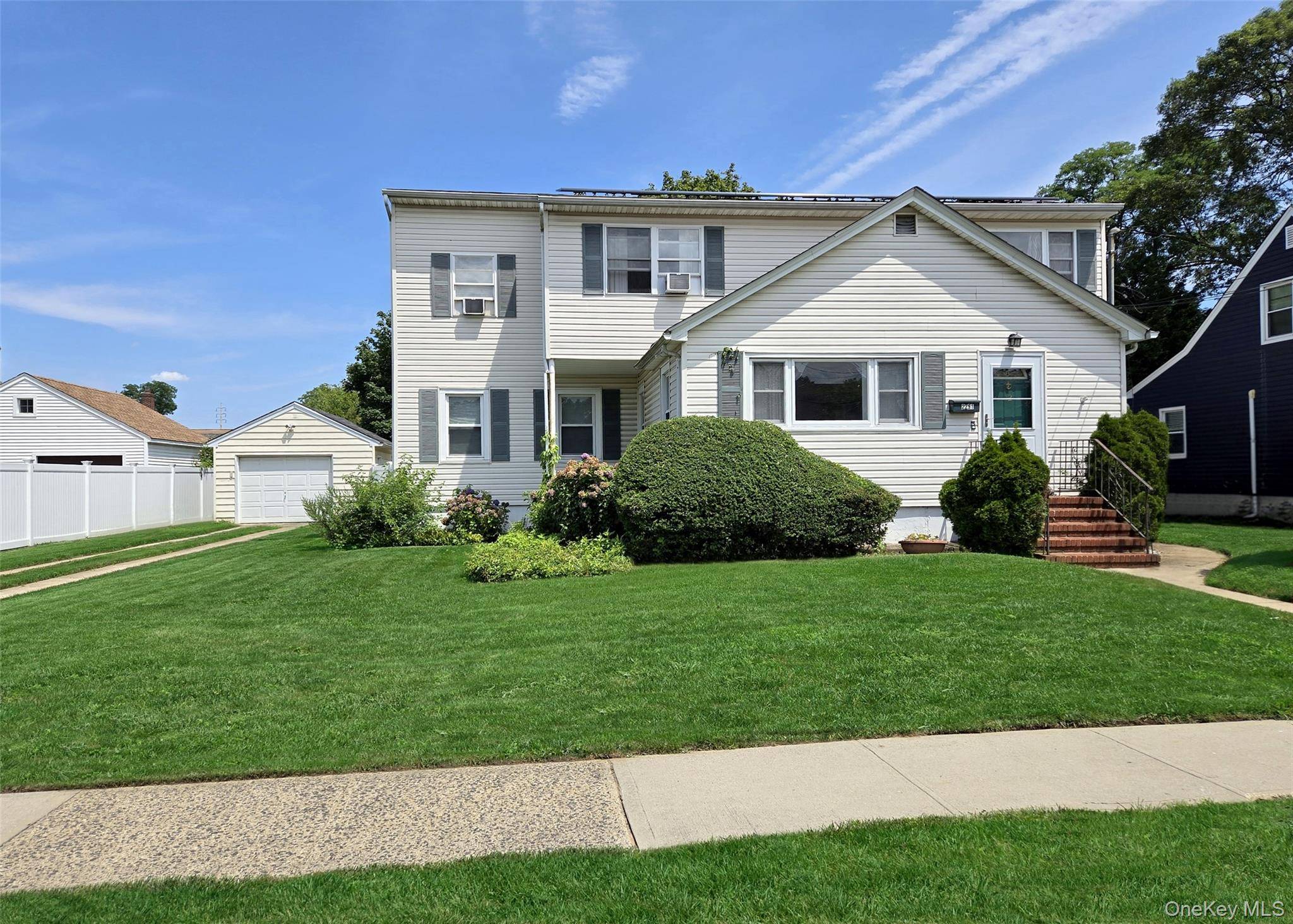 Welcome to this exceptional and versatile home, perfectly set on an oversized lot in the vibrant heart of Merrick !