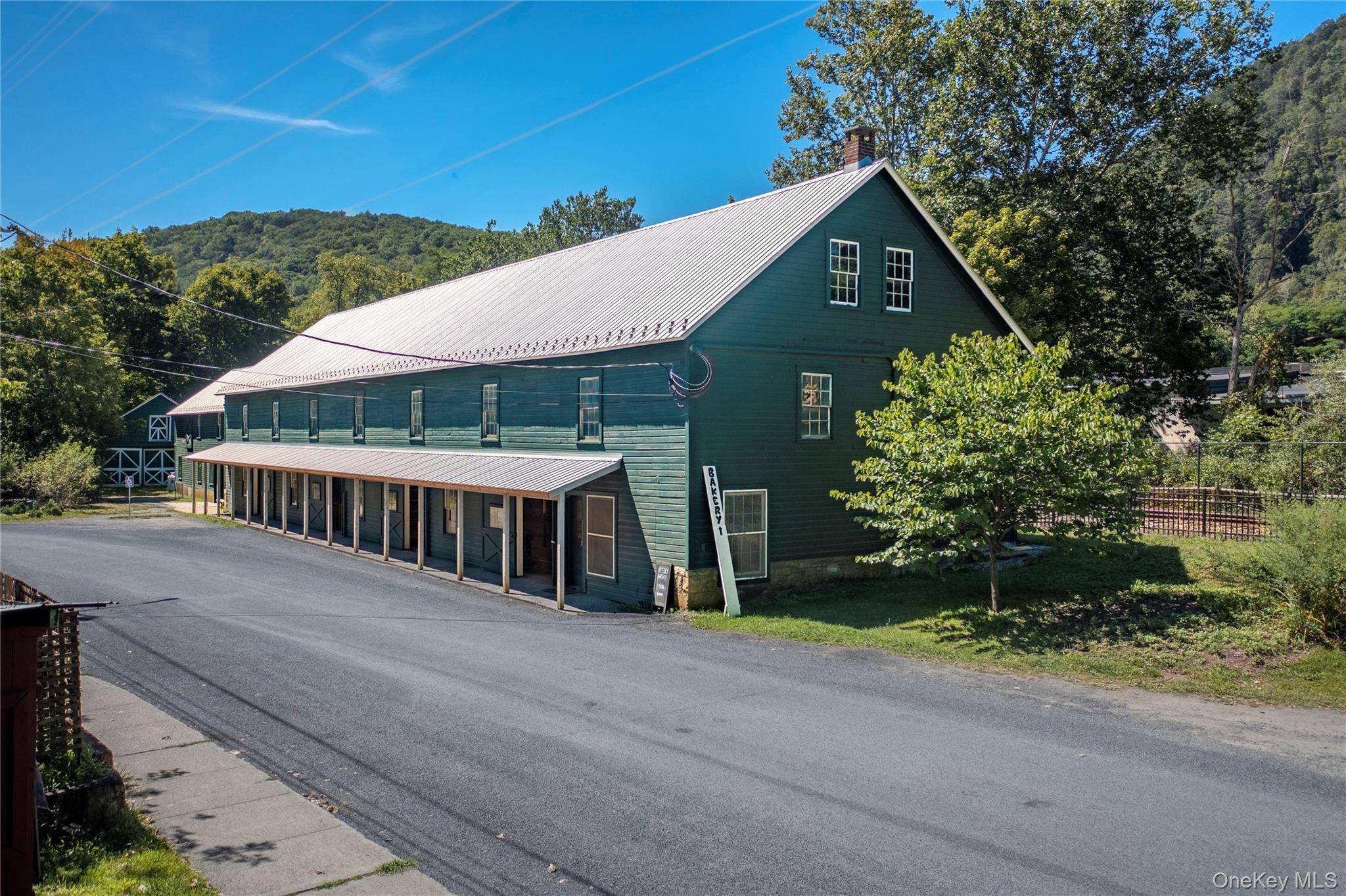 Nestled in the heart of Wassaic Hamlet on Main Street, this meticulously revitalized 1920s two story barn, spanning 10, 640 SF, stands as a testament to craftsmanship and vision.