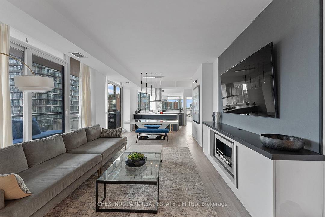 Welcome to this professionally designed, executive furnished suite, beautifully renovated corner suite with soaring ceilings and expansive east facing windows.