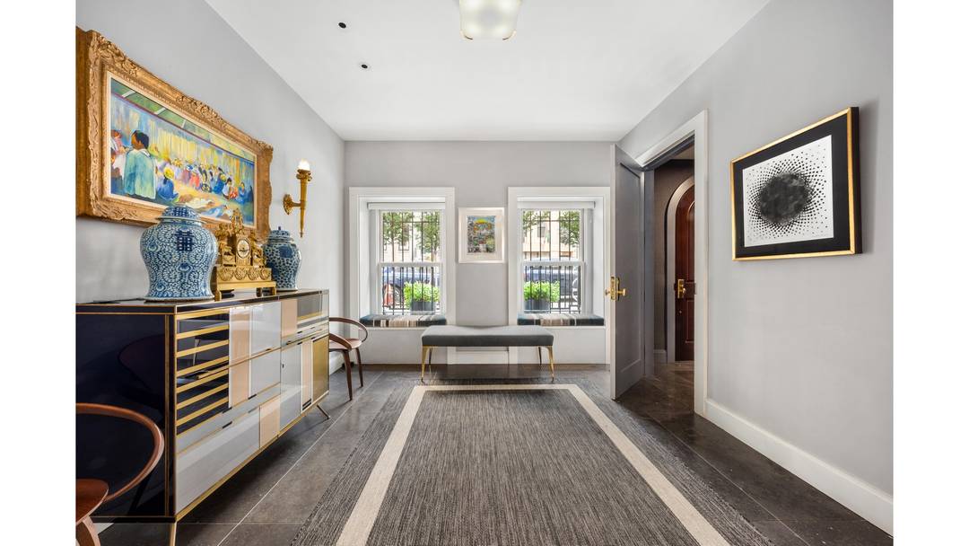 Built in 1910 and thoughtfully reimagined for modern living, this distinguished 20 foot wide, elevator townhouse seamlessly blends timeless architecture with contemporary sophistication.
