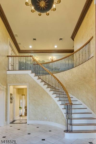 5, 000 Sq Ft Residence Curved Staircase Private Lower Level Living Designed for layered living and effortless flow, this expansive residence offers a refined balance of scale, structure, and flexibility.
