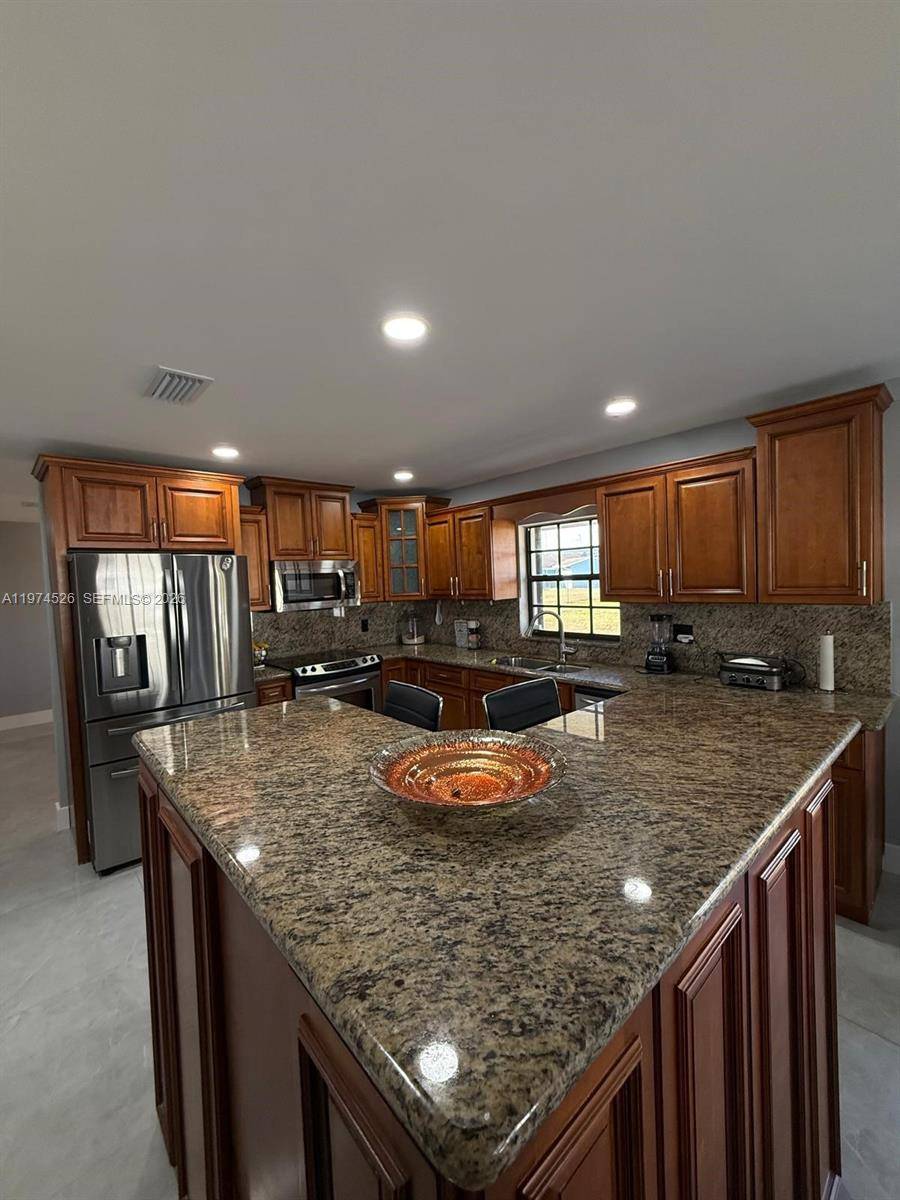 Beautifully remodeled 3 bedroom, 2 bath home on a rare 12, 000 sq ft lot in Miami Gardens.