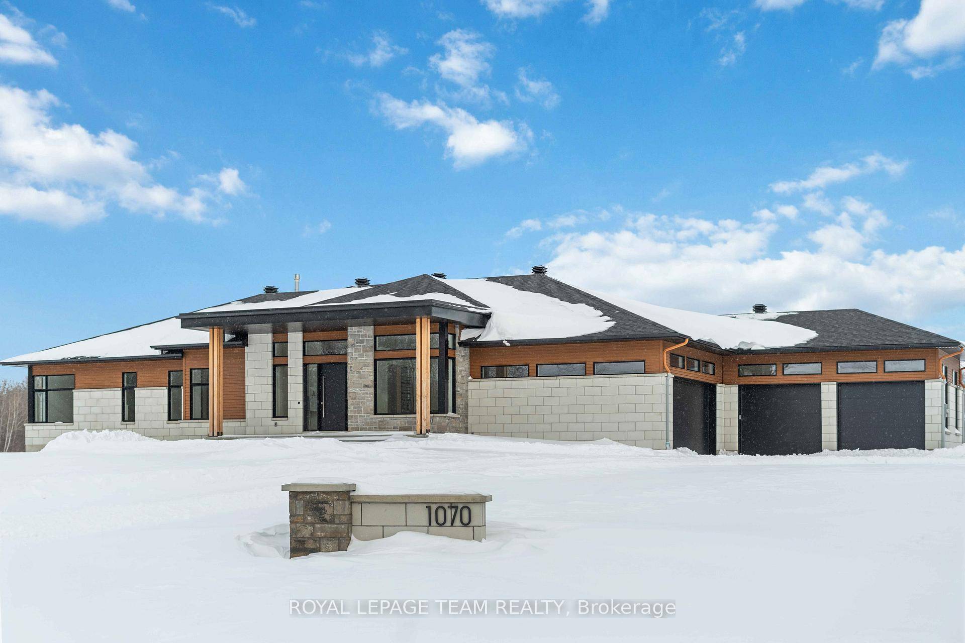 This luxurious dream home in Greely offers grand design, high end finishes, and modern amenities.