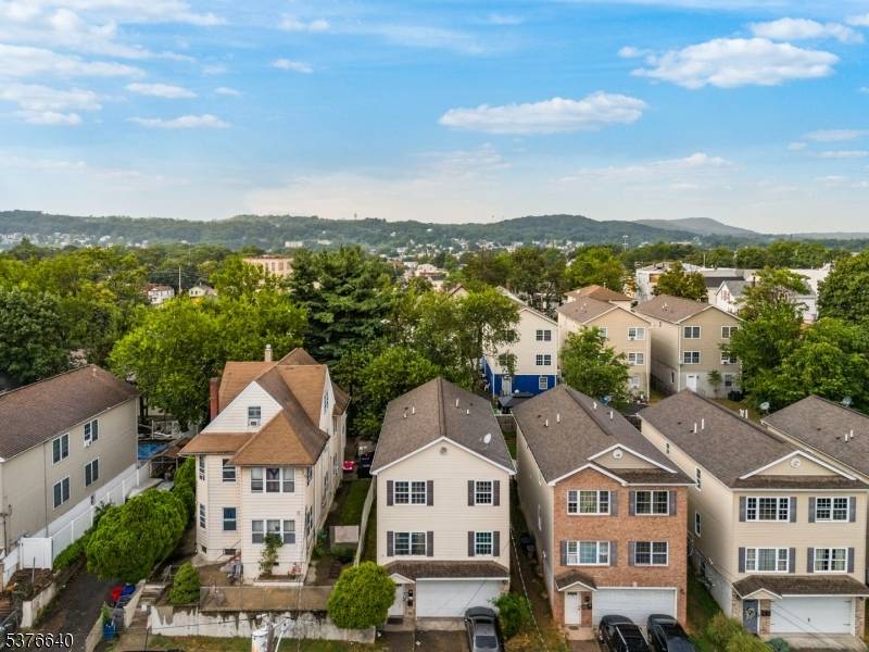 Unlock the potential of this beautifully maintained 2 family home built in 2006 !