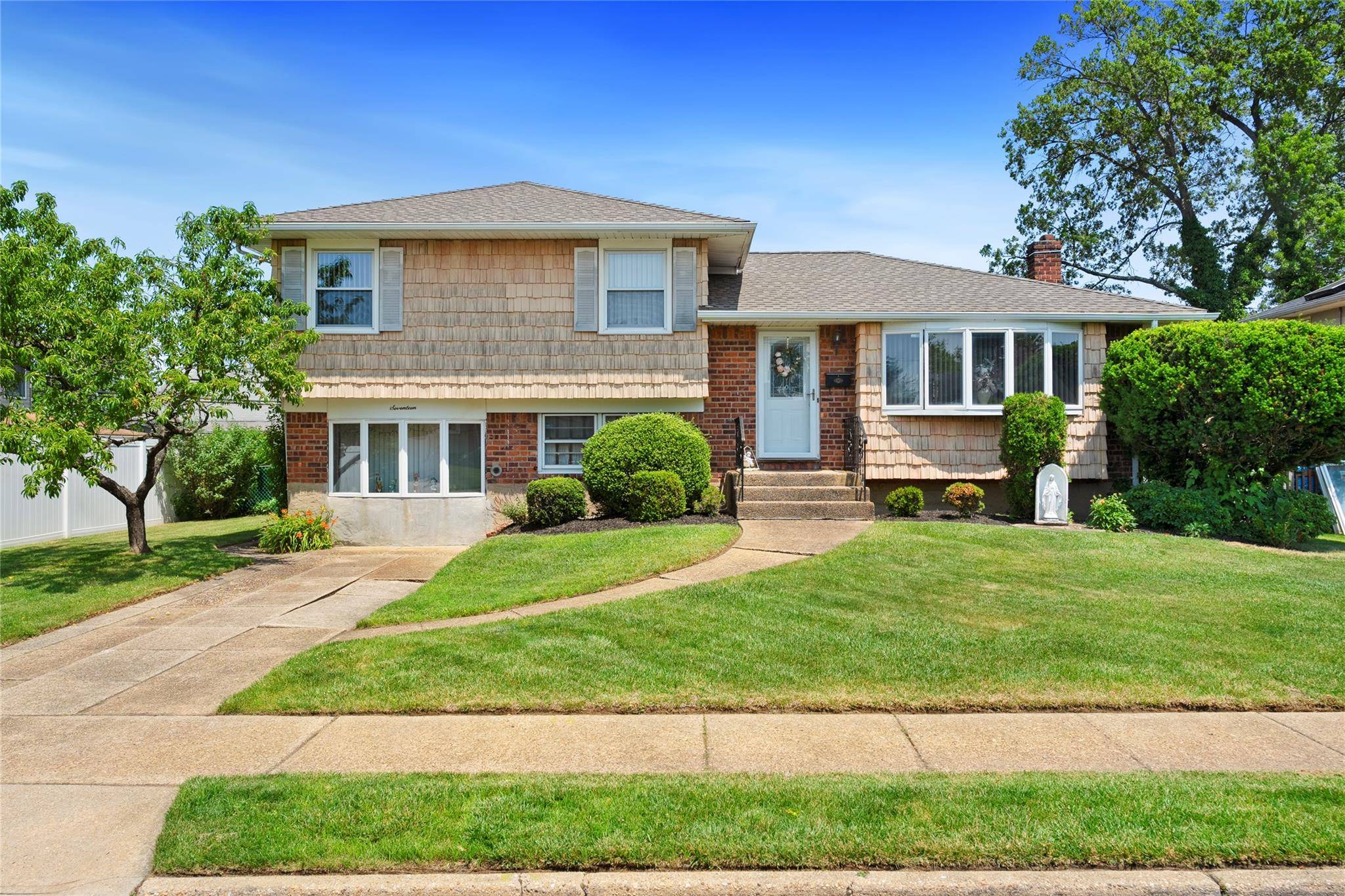 This delightful 4 bedroom, 2 bathroom split level home offers the perfect mix of comfort, charm, and character.