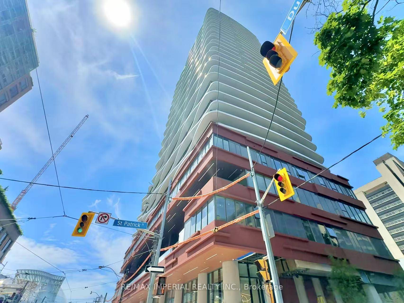 Brand new 1 bedroom condo unit featuring a modern, sleek kitchen and floor to ceiling windows.