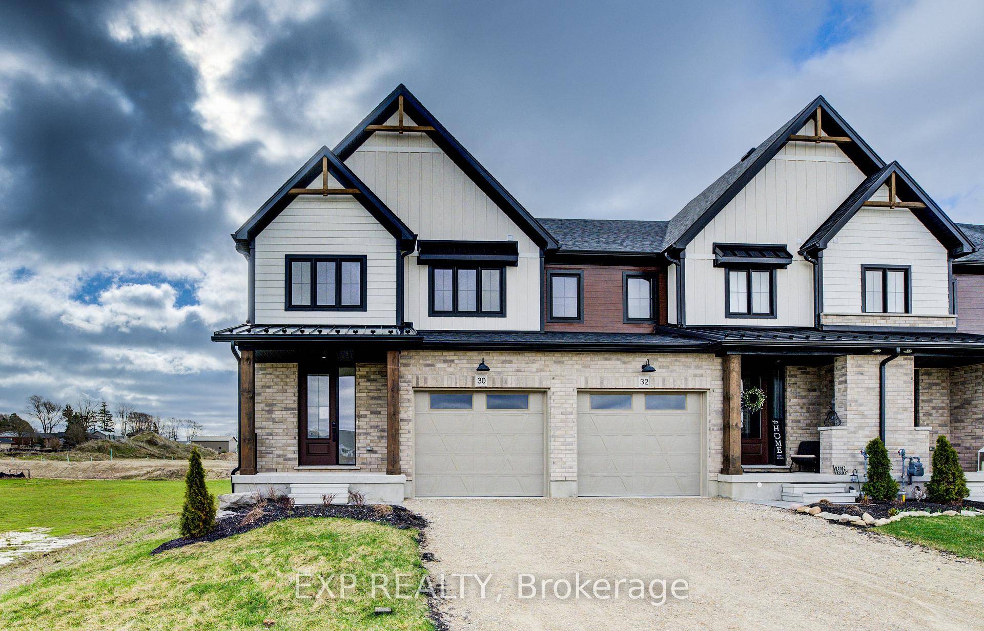 Step into modern farmhouse living with this beautifully finished end unit townhome available for immediate occupancy !