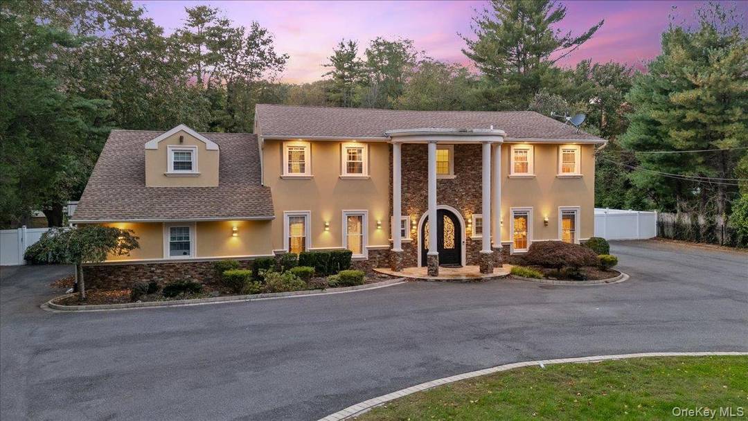 Welcome to this exquisite gated estate, a meticulously updated 5, 000 square foot center hall Colonial masterpiece that exudes timeless elegance and sophistication.