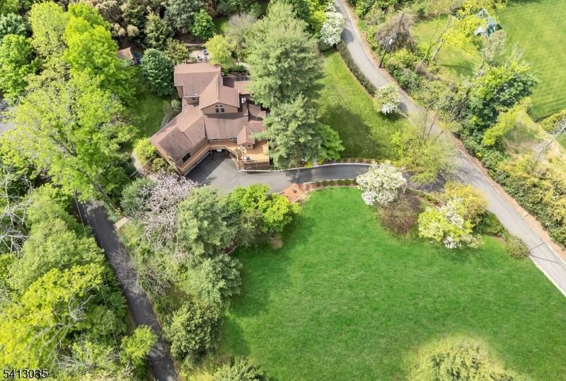 Stunning custom home gracefully set on a serene 1.