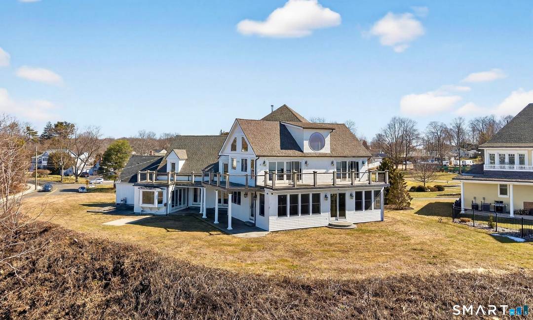 Perched high atop a scenic bluff, this extraordinary coastal retreat offers some of the most breathtaking water views in all of Milford, with sweeping, nearly 360 degree vistas of Long ...