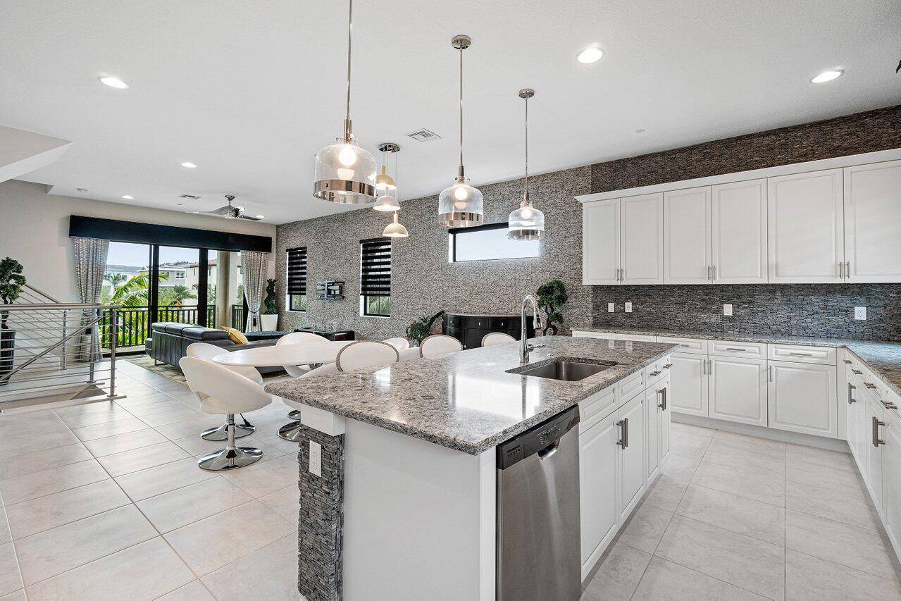 Impeccably maintained corner unit Townhome with over 150, 000 in upgrades in highly sought after Alton, located in Palm Beach Gardens.