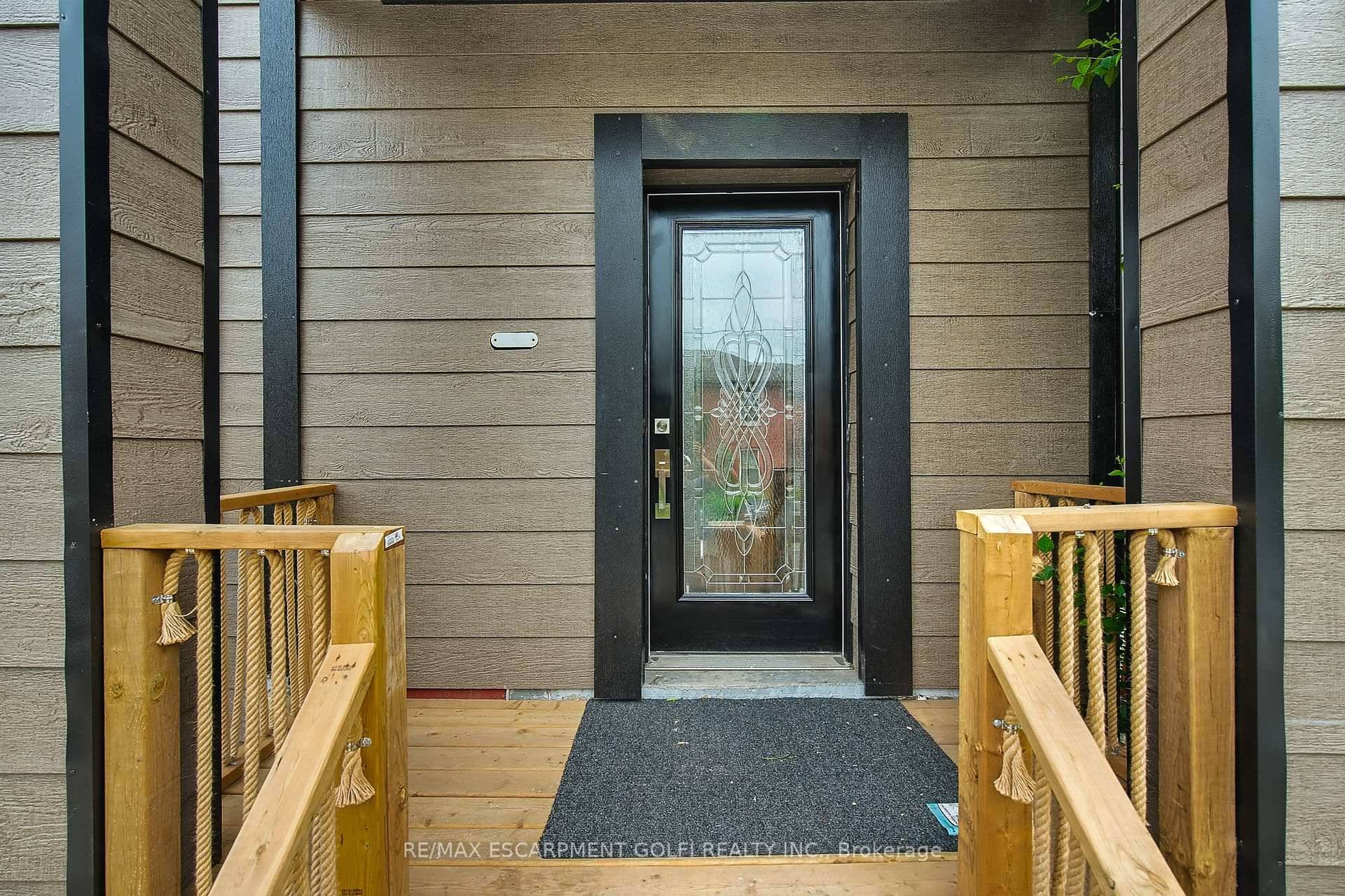 Welcome to 111 Wellington Street South, Hamilton a turnkey legal duplex offering exceptional value and modern charm just minutes from the Hamilton GO Station and all amenities.