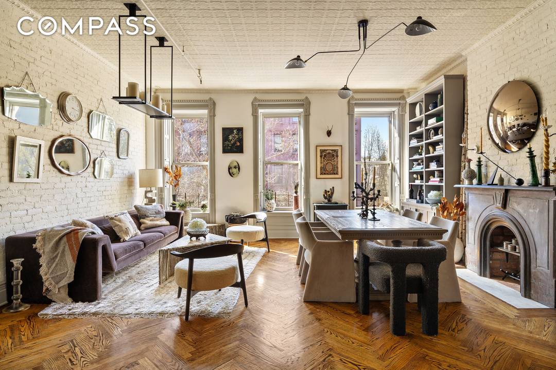 Originally built circa 1925, this meticulously reimagined 19 foot wide two family townhouse with 5 flex 7 bedrooms, 4 baths combines sophisticated design, income potential, and flexible living.