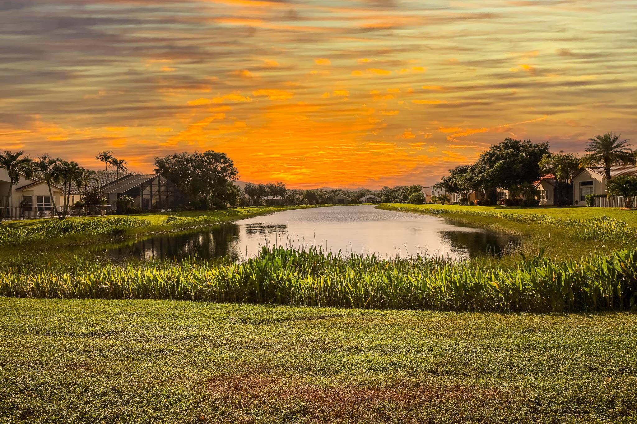 Looking for sunsets over a long view of theLAKE, SITTING ON YOUR PATIO THEN THIS HOME IS FOR you !