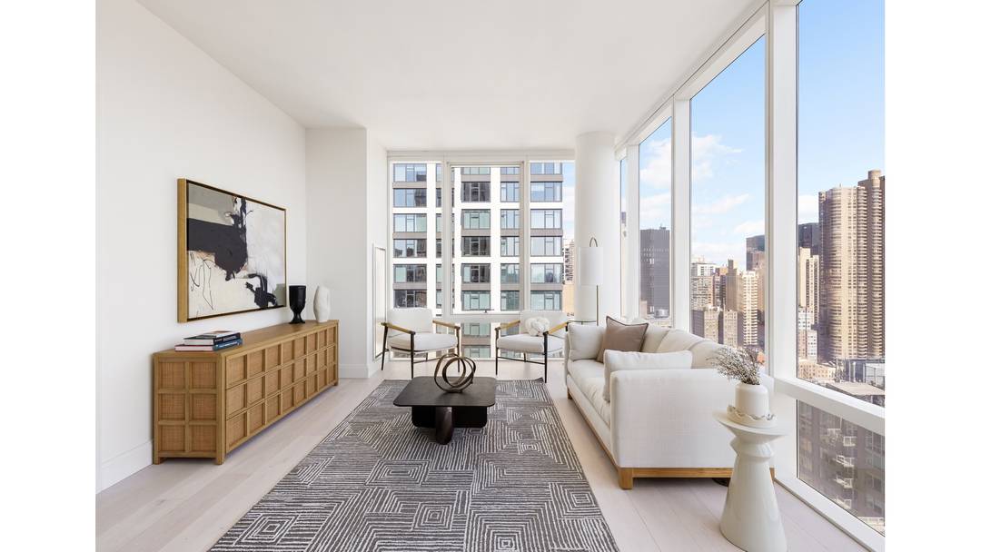 Luxury corner home with 10' floor to ceiling windows and expansive views of the River, Manhattan skyline and Long Island City.