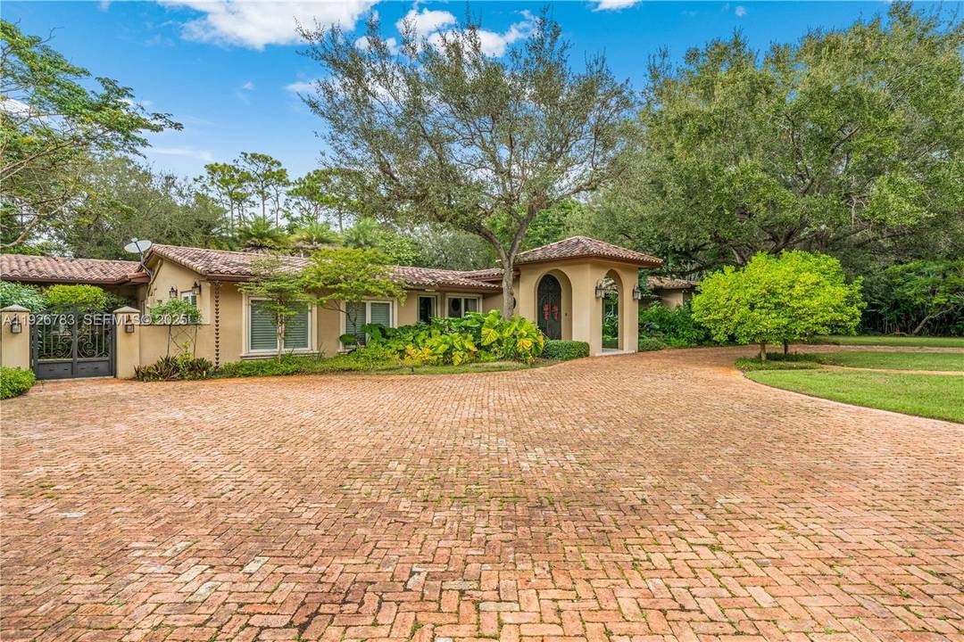 This North Pinecrest Gem has been tastefully updated and is beautifully positioned on this spectacular, oak studded lot !