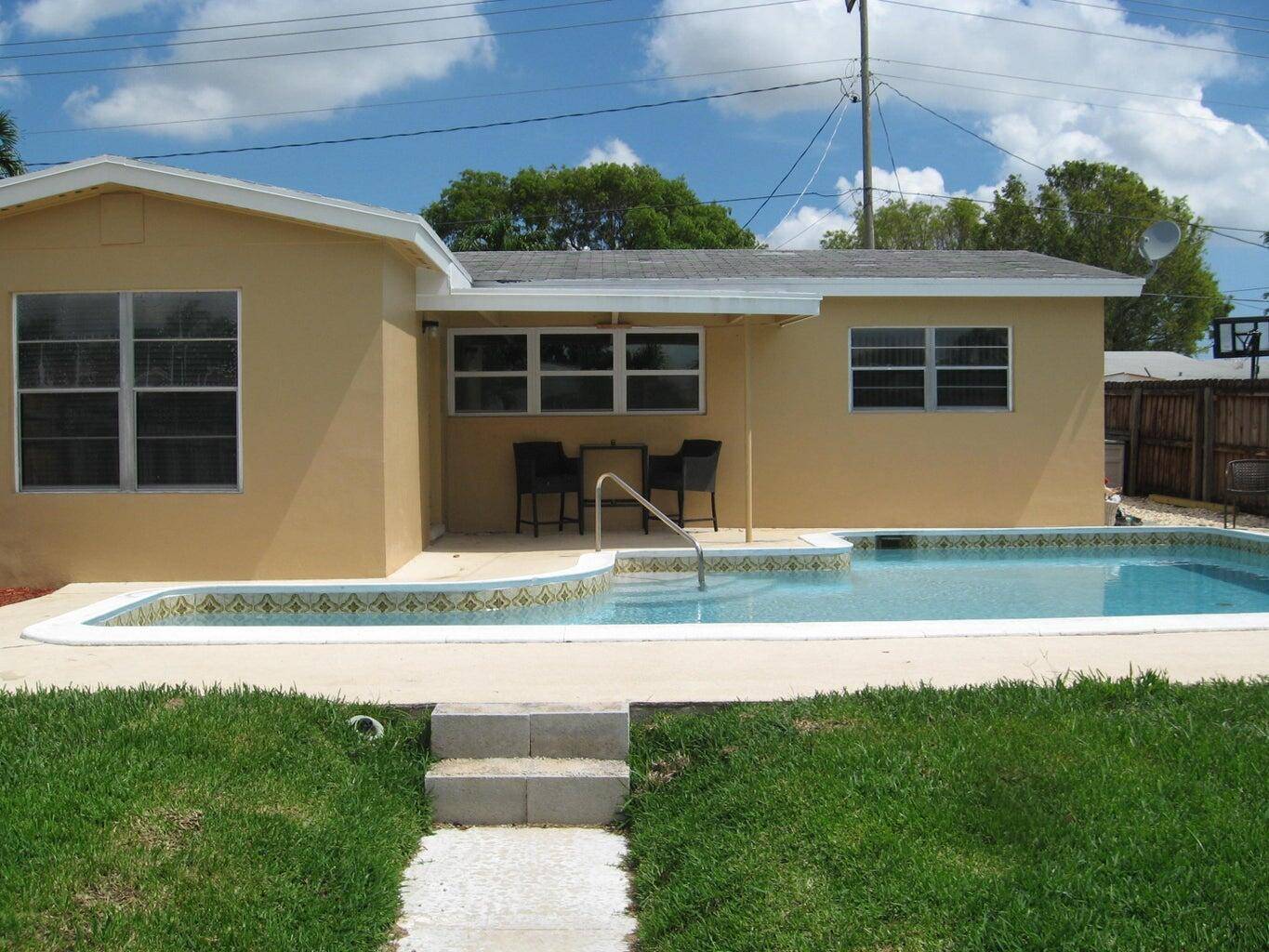 Resort style pool home. 1950's home with fireplace.