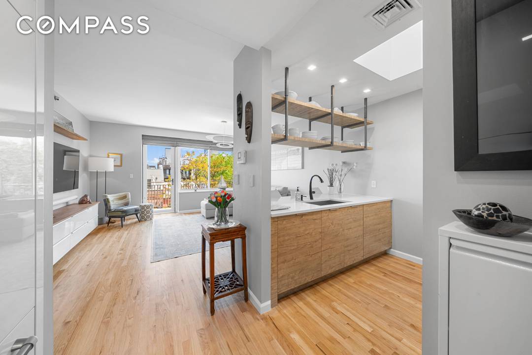 PENTHOUSE PERFECTION JUST IN TIME FOR SUMMER Step into this triple mint, fully renovated penthouse, where modern luxury meets effortless charm.