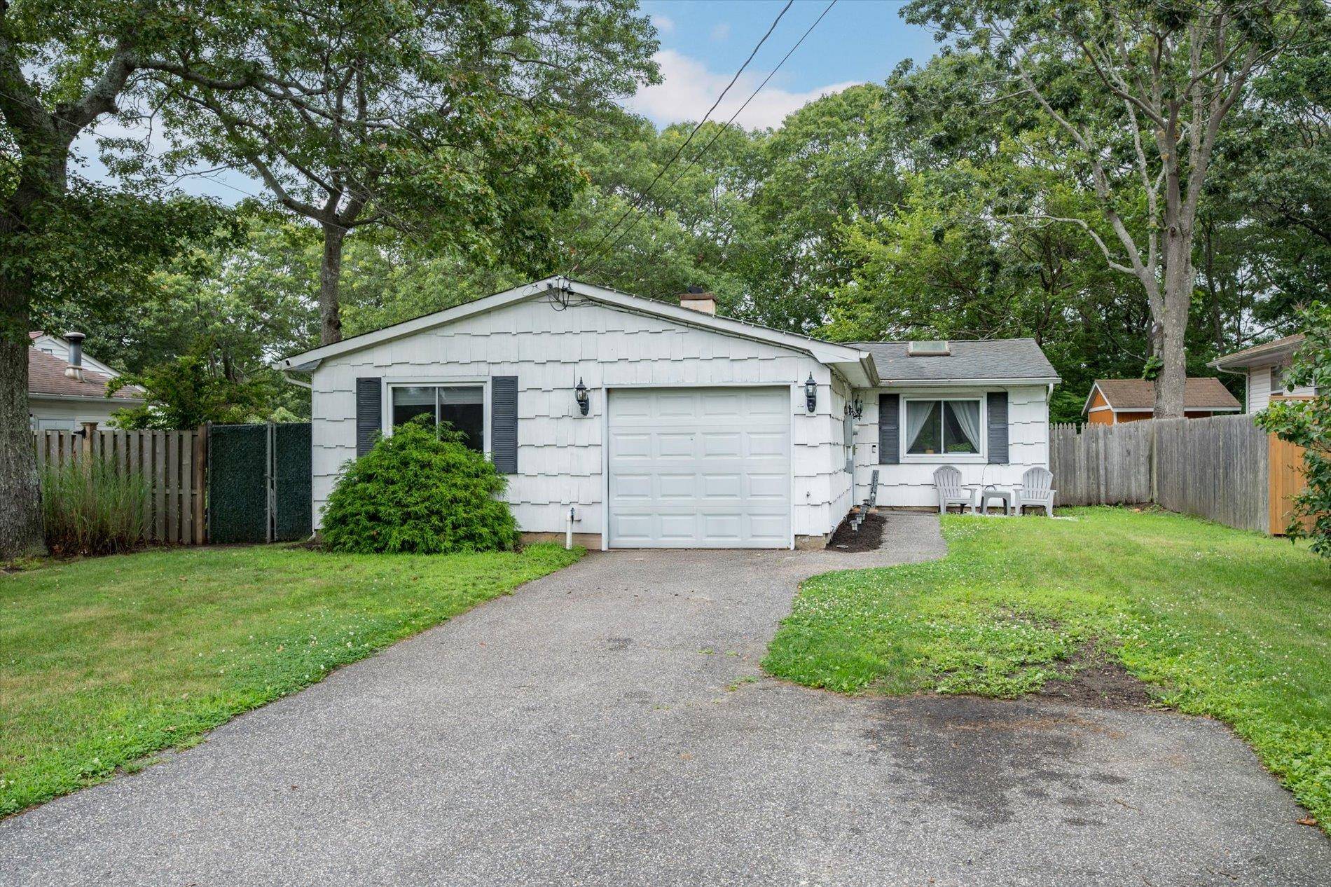 This charming 3 bedroom, 1 bath ranch sits on a spacious 0.