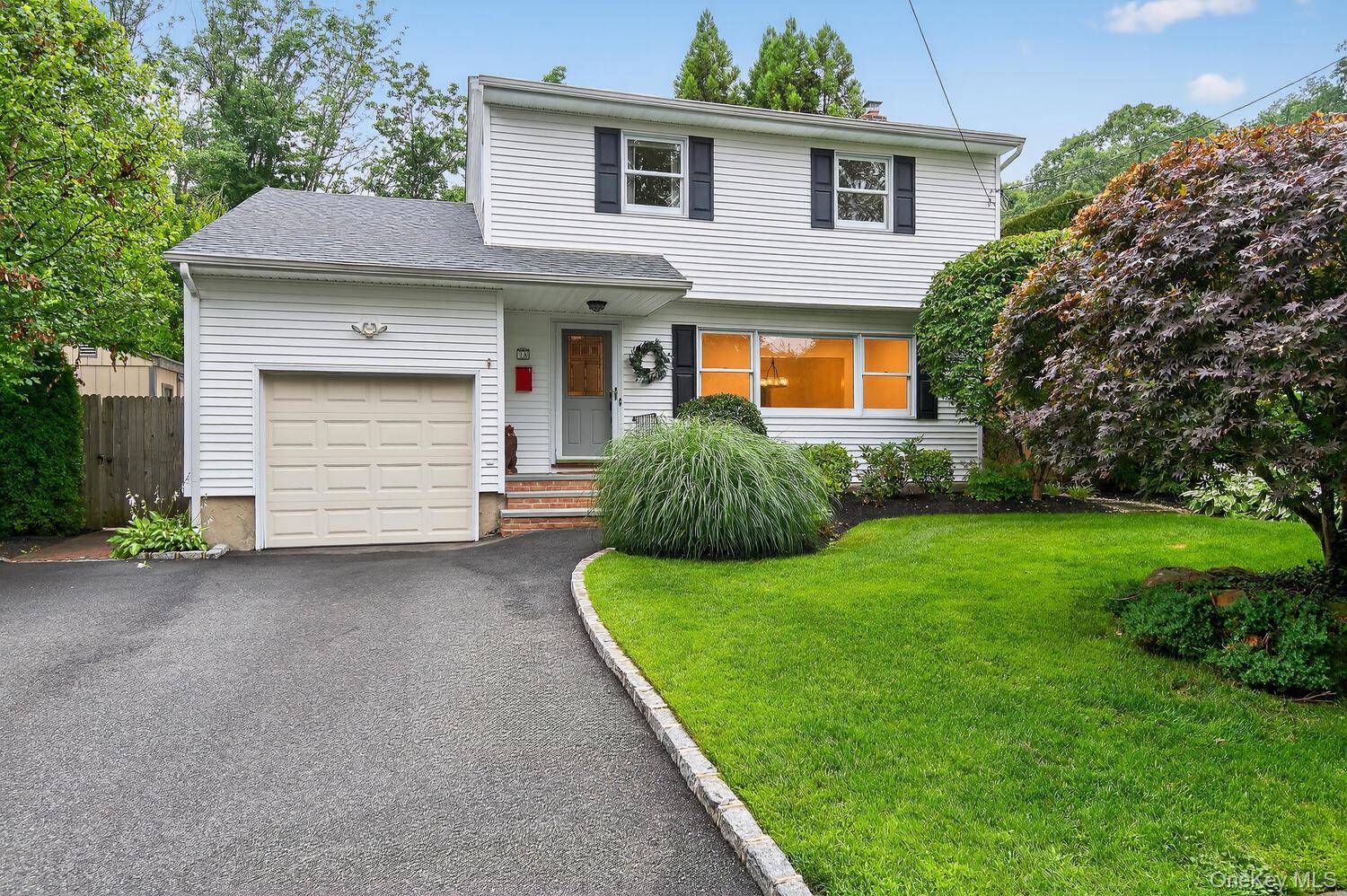 Nestled just moments from the vibrant Village of Huntington, this beautifully updated Center Hall Colonial seamlessly blends classic charm with modern amenities.