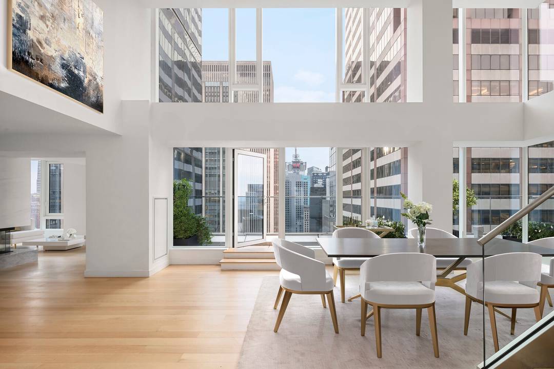 This extraordinary duplex penthouse soaring high above Midtown will take your breath away with its jaw dropping city views, meticulously designed interiors, and generous private outdoor space.