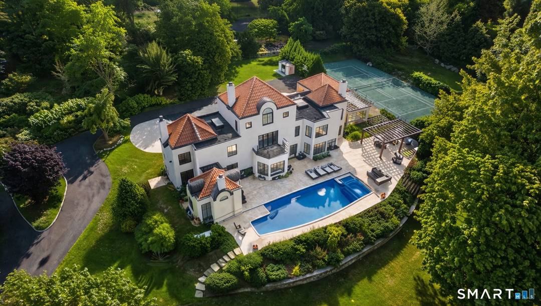 Set behind gates on over four exquisitely landscaped acres in Westport's coveted Beachside enclave, 69 Beachside Avenue is a private coastal estate offering a rare blend of scale, privacy, and ...