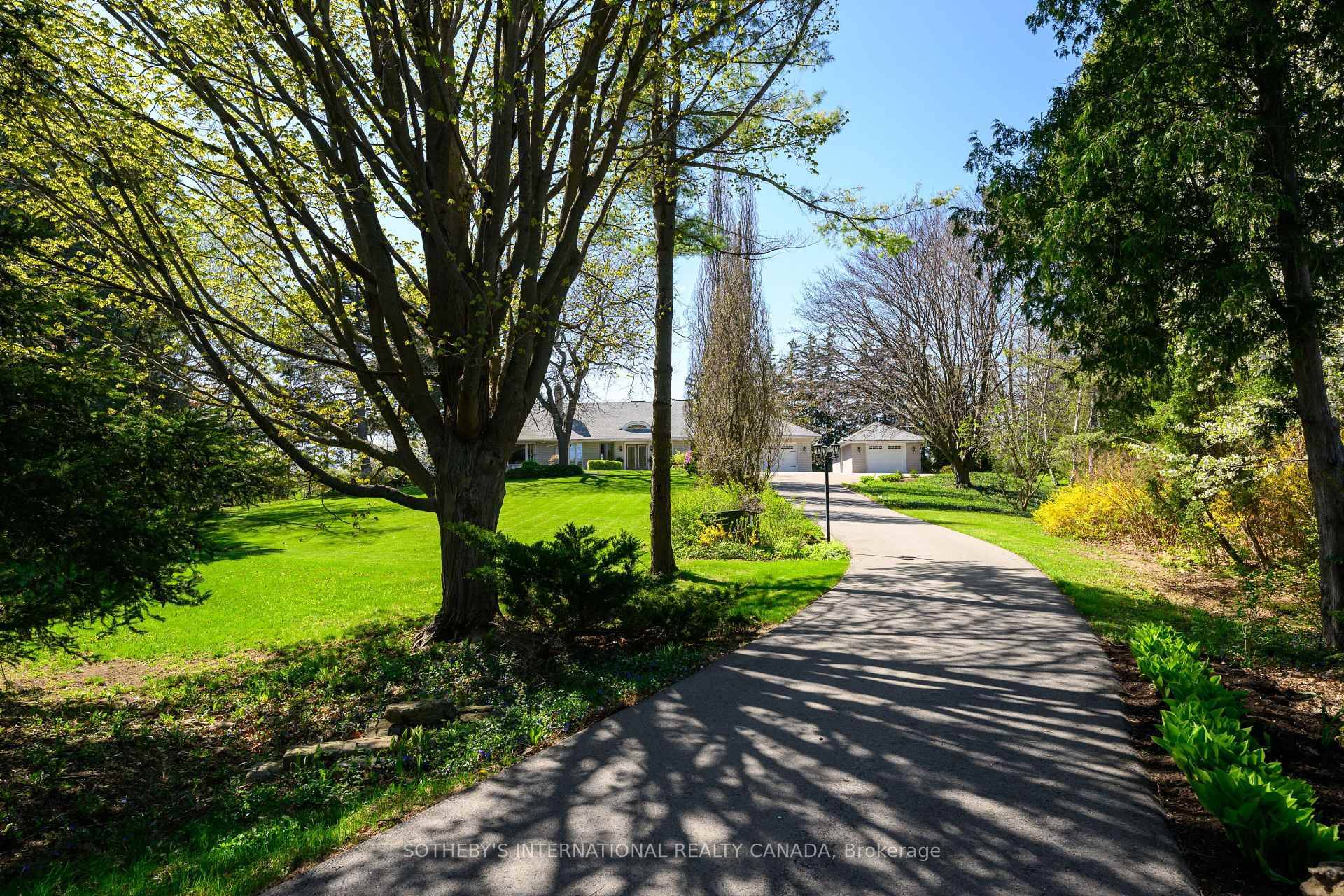 Follow the winding 400 foot paved driveway and discover a world of privacy, elegance, and serenity all just minutes from the city.