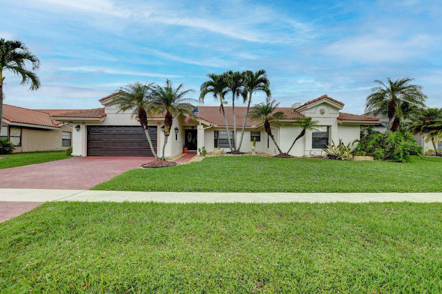 Beautiful 4 bedroom 3 bath Single Family Home in West Boca with a large screened in patio and private pool overlooking the lake !