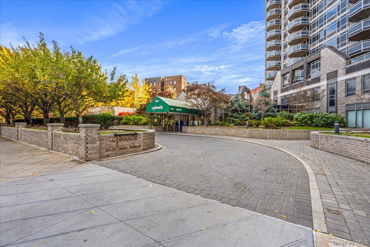 Welcome to this Bright and Spacious 1, 327 sqft Corner Unit at the Luxury Pinnacle Condominium in Forest Hills.