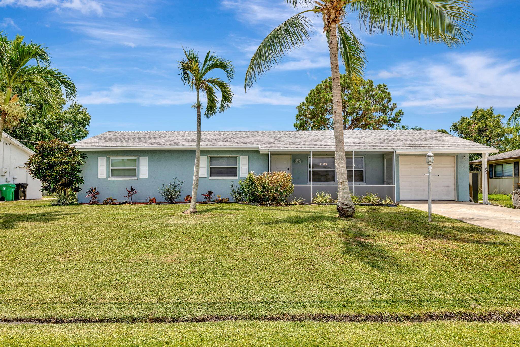 Welcome to this charming spacious 3BR 2BA Pool Home with Oversized Patio perfectly situated in the vibrant heart of Port St.