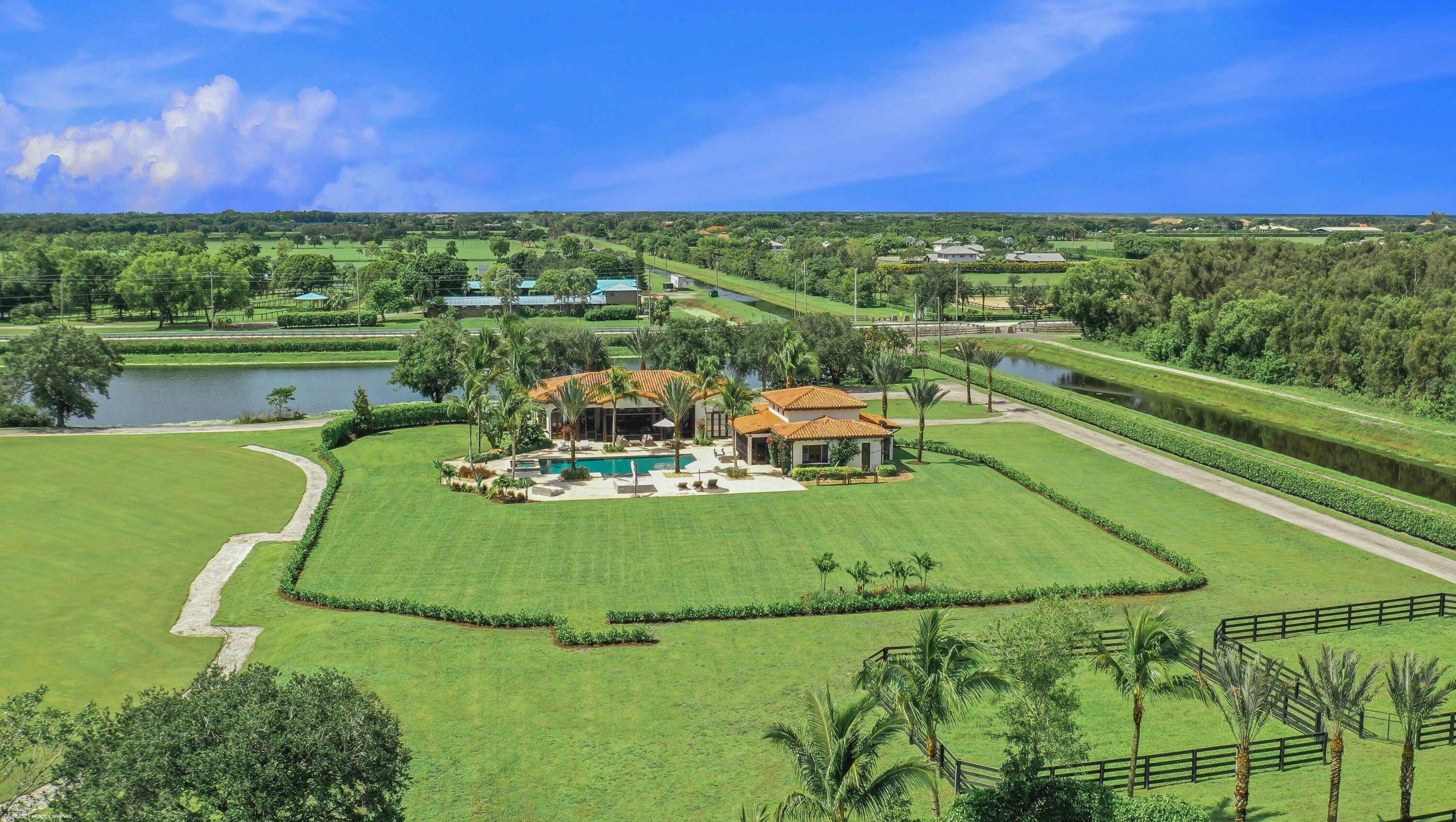Experience the equestrian season in unparalleled luxury in this stunning 3, 700 sq ft Main home and Guest House included, located just steps from Wellington International !