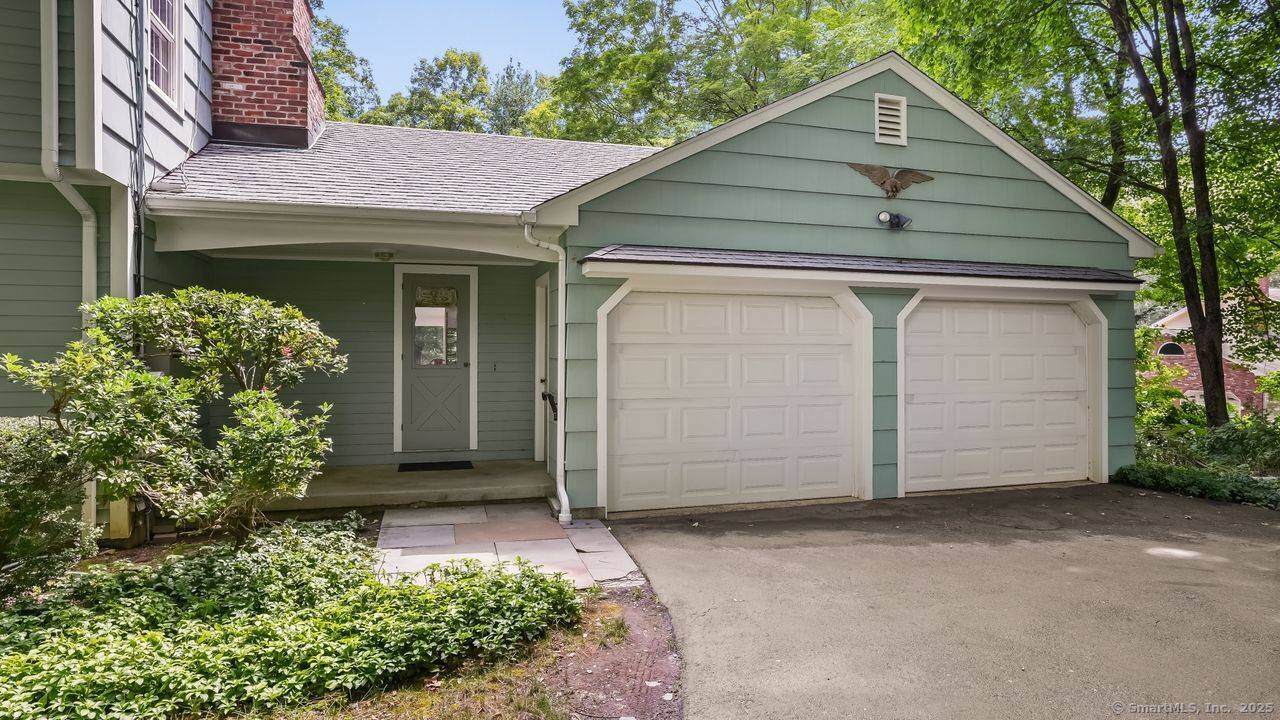 Set back from the road and surrounded by nature, this beautifully updated 4 bedroom, 3.