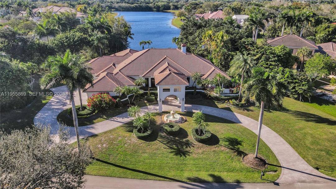 SPECTACULAR LAKEFRONT ESTATE located in the prestigious, guard gated community of Windmill Ranch Estates, offering BREATHTAKING PANORAMIC LAKE VIEWS AND UNFORGETTABLE SUNSETS !
