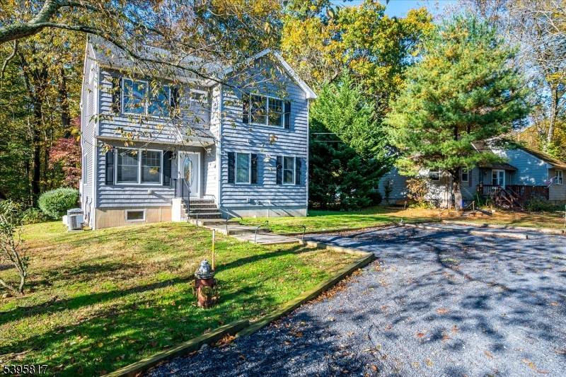 NEWER COLONIAL HOME BUILT FROM THE GROUND UP IN 2018 in a picturesque setting on a cul de sac with lake views !