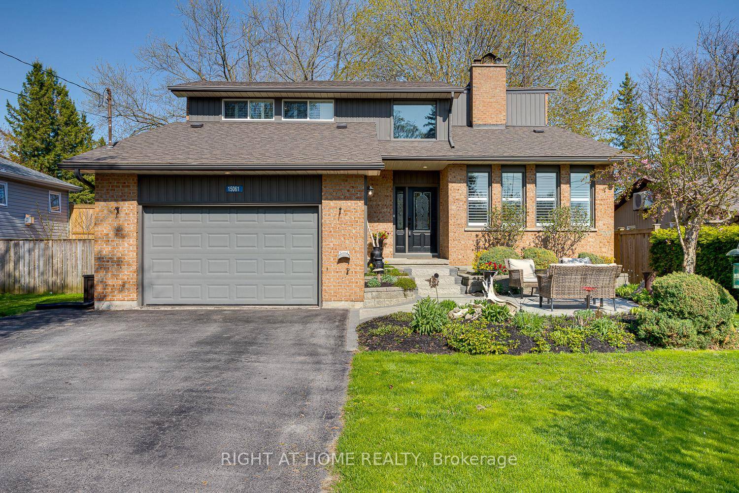 This coveted all brick family home is nestled on a picturesque, tree lined street just a short stroll from town.