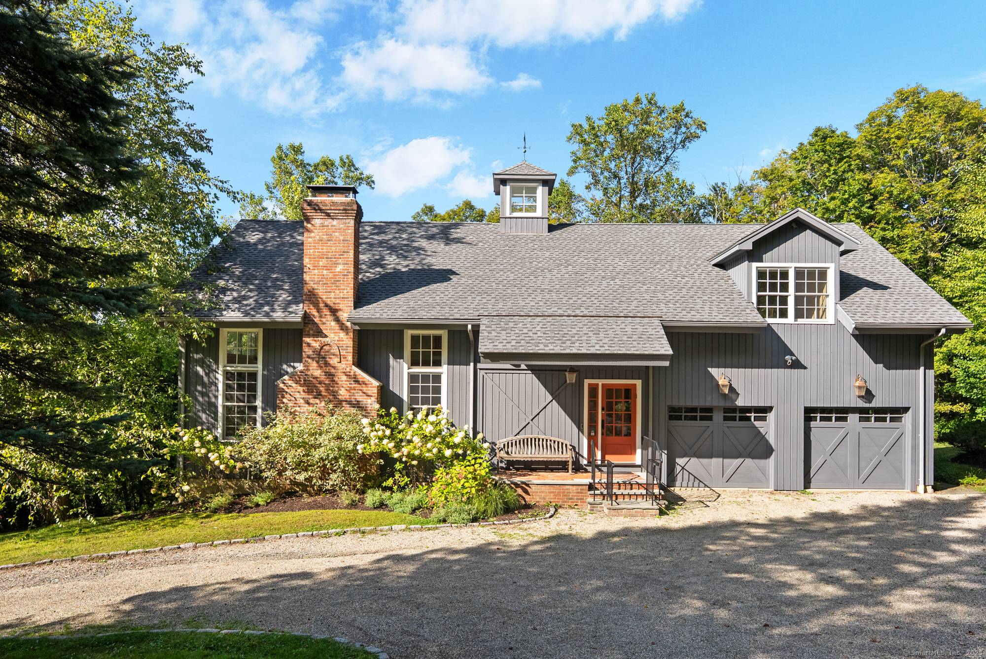 This stunning barn style contemporary home is tucked away on a quiet country road, less than a mile from Lake Waramaug.