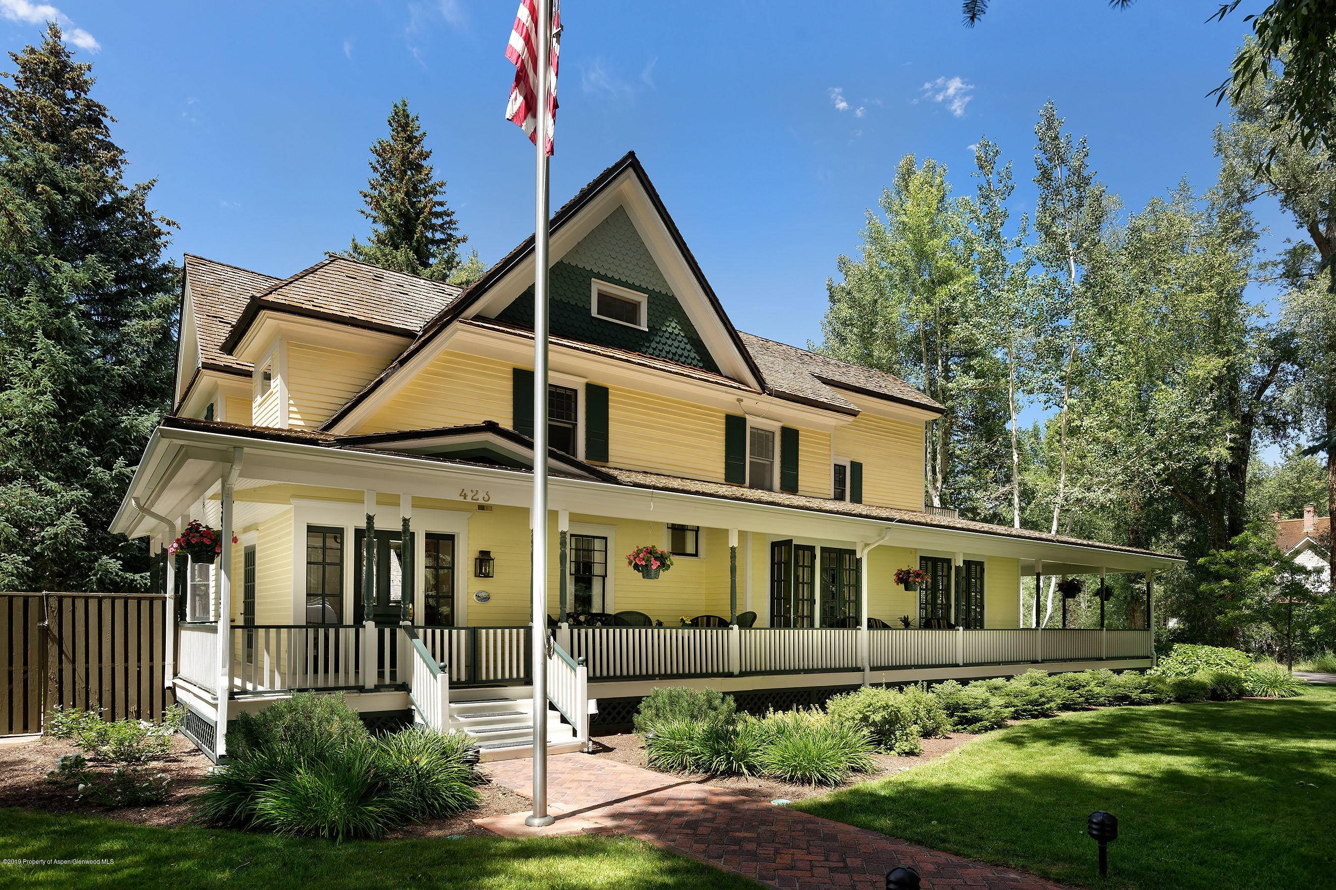 Step onto the wrap around porch and enter one of Aspen's iconic 5 bedroom Victorian homes in the West End situated on a private double lot with lush gardens.