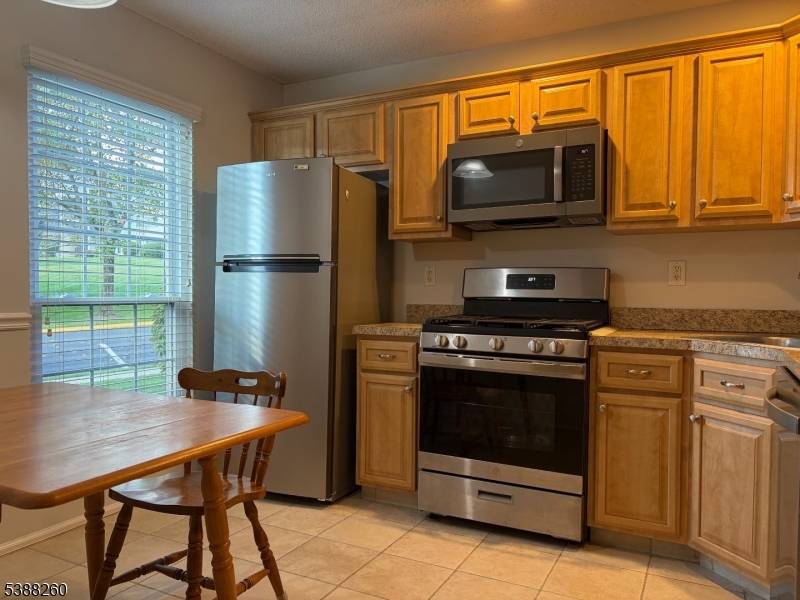 Welcome to this sun filled townhouse end unit in Basking Ridge.